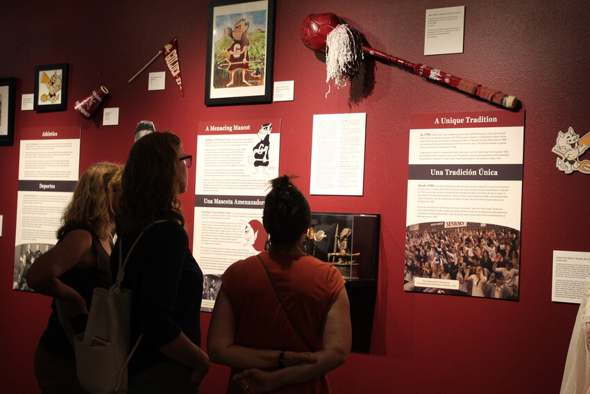 Golden High School alumni examine the Golden History Museum's new exhibit on the school's 150-year history Aug. 24. The museum hosted a grand opening and reception for alumni and other visitors to see the new exhibit.